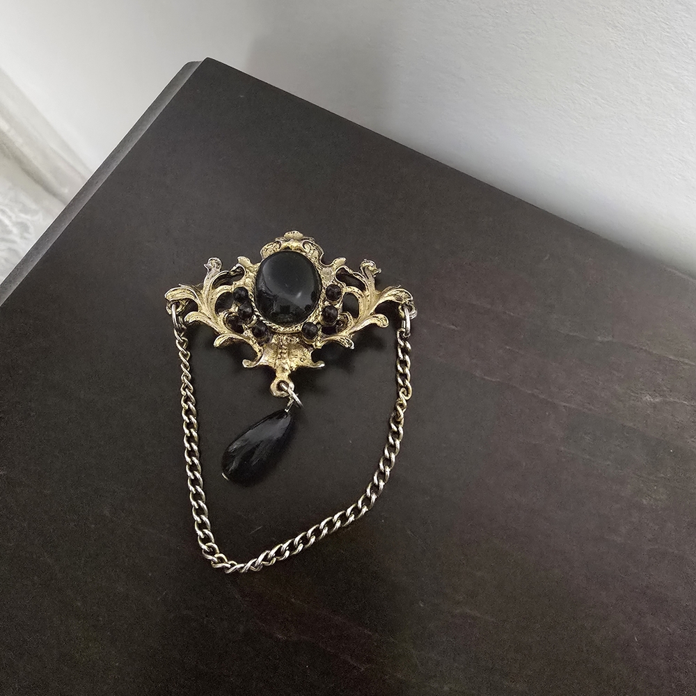Elegant Black and Gold Brooch